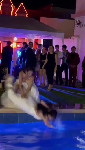 Pool Party Mishaps: White Dress Falls In