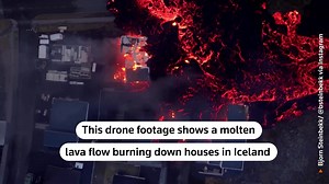 This drone footage shows a molten lava flow burning down houses in Iceland. | Reuters