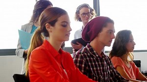 Business executives working on computer at desk