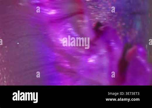 Vertical video. Dripping glitter. Defocused art splash. Shimmering ink pink purple flow ball. Dissolving colorful dye in water abstract background rainbow Stock Video Footage - Alamy