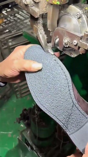 Industrial Machine Stitching a Leather Shoe Sole
