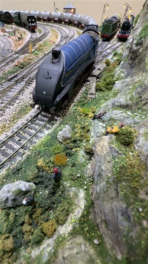 Golden Eagle pulling Benzene past the train spotters.