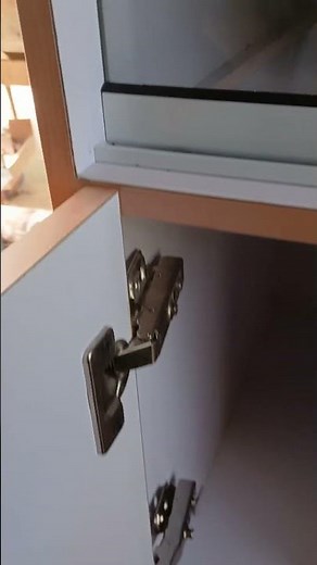 Install the cabinet door and adjust the position with the labjack