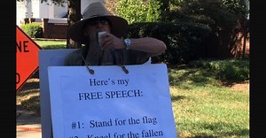 One football fan took his own protest outside to an NFL practice