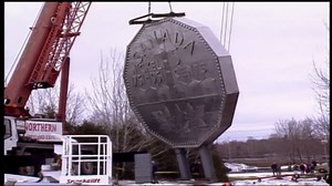 Did you know that Sudbury's iconic landmark, the largest coin in the world, took a roadtrip to Science North in April of 2001? The giant nickel was pulled from its original location on Big Nickel Mine Road for refurbishing, which lasted approximately two years. Once the detailed cleaning was completed the giant nickel relocated to Big Nickel Mine at Dynamic Earth on May 10, 2003. | Credit: CBC Archives | CBC Sudbury