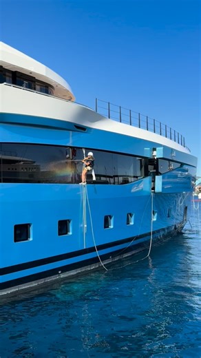 57K views · 2.5K reactions | 什✨ When your yacht windows are bigger than most people’s apartments… you need a crew with no fear of heights. Spotted ahead of MYS 2025: the fearless crew on 77.7m AMALYA (Admiral Yachts) dangling in harnesses, giving her glass the ultimate polish before guests arrive. Who needs superheroes when you’ve got a yacht crew like this? ️ | YachtBuyer | Facebook