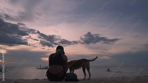 tourist with dog on white beach Puka Shell, Boracay Island, Philippines