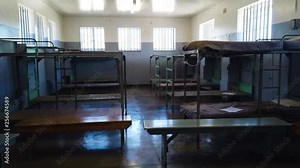 A follow shot exploring a group cell at Robben Island prison in Cape Town, South Africa.