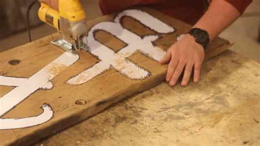 Watch how this guy turned old barn wood into a business sign