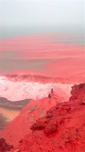 Geo News English on Instagram: "Heavy rains on Hormuz Island in southern Iran have turned parts of the island’s famous Red Beach a vivid crimson, stunning visitors and social media users alike. Video shows rainwater carrying rich red soil, called golak locally, from the island’s slopes into the sea, coloring both the sand and water a deep red. Hormuz Island, located in the Strait of Hormuz in the Arabian Gulf, is known for its naturally red soil and colorful landscapes. The iron-rich soil gives 