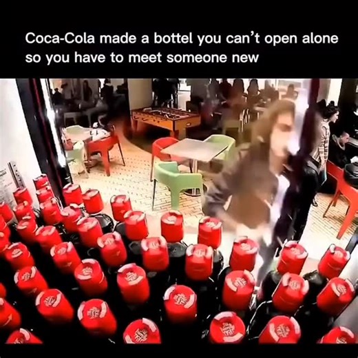 The Explainer on Instagram: "Coca-Cola once used smart marketing to turn a bottle into a social test. In 2014, the Friendly Twist campaign launched bottles people could not open alone. Each cap required two Coca-Cola bottles twisted together before either opened. You had to find another person with a Coke to take a sip. The goal was connection, not soda. The design pushed strangers and new classmates to talk, cooperate, and share a moment. One small change in packaging created real human interac