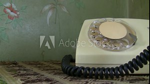 Vintage scene, old rotary telephone close up. Hand is picking phone receiver, dialing number and putting handset down Stock Video