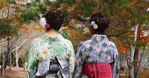 Young Japanese women walking through a park in Kyoto.