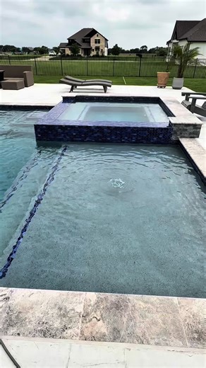 Luxurious Raised Spa and Waterfall Pool Design