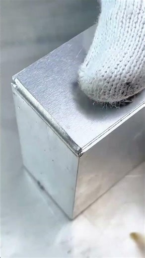 A Handheld Laser Welding Machine Joining Two Metal Plates