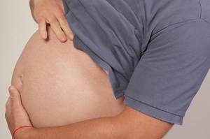 Trans couple puts their transition on pause to have a baby