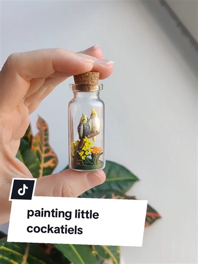 painting two little cockatiels I've made 🦜 It looks so fast here when in reality it took longer than an hour! But I love making things with tiny details and making sure everything is just right! #clayart #tutorial #fy #miniature #arttiktok #fyp #tiktokart #cockatiel #bird #petbird #acrylicpaint