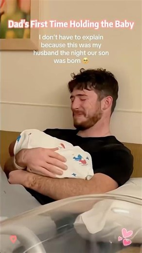 dad's first time holding the baby💞