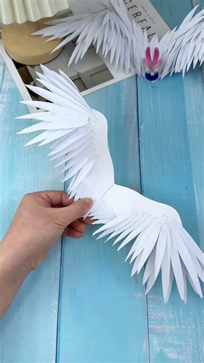 The ultra-detailed origami tutorial of feathers and wings will produce a beautiful finished prod