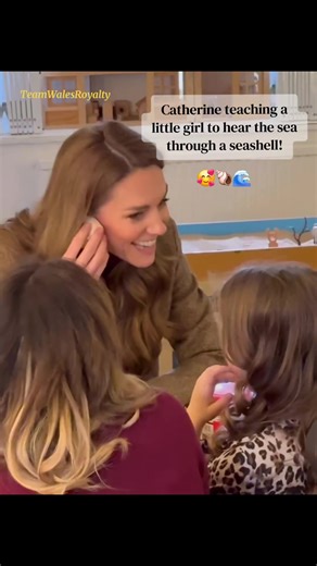 Catherine Teaches a Little Girl to Hear the Sea