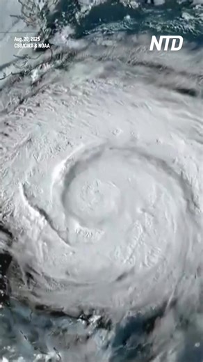 High waves pounded the shore and floodwaters surrounded homes in Buxton on Hatteras Island, North Carolina. Sand dunes were being built up on Pea Island along the coast of North Carolina ahead of Hurricane Erin. | NTD Life