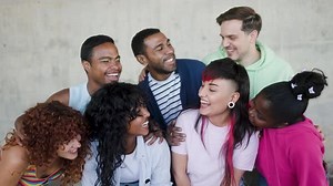 Diverse group of friends having fun smiling outdoor in summer day. Young people celebrate holiday va
