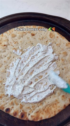 Dill Pickle Pizza 🥒🍕Pretty sure it’d be Grinch Approved if he had a slice. I love this pizza because it has a nice balance of salty and sourness. & I like dipping it in marinara sauce! Would you try this pizza?? You’ll need about 2 cups of sliced pickles. Make sure to dry them well. Place the sliced pickles on a paper towel and gently pat them dry to remove excess moisture. To make the garlic dill sauce, mix together 1/2 cup sour cream, 1/4 cup mayo, 1/2 teaspoon salt, 1/2 teaspoon garlic powd