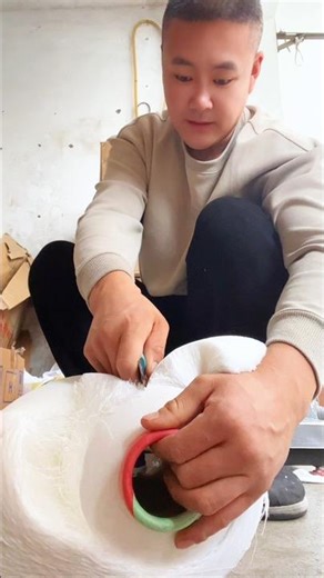 Unwinding a Massive Spool of Industrial White Thread