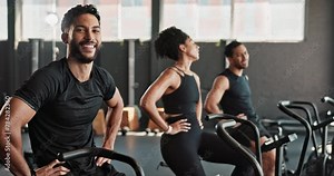 Man, face and cycle in gym, tired and finish with training or exercise to build muscle on arms or legs. People, crosstrainer or bike for cardiovascular strength and slow down for break or energy.