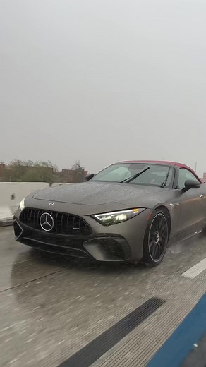 Sleek Gray Mercedes-Benz Convertible on Wet Highway