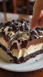 Triple Chocolate Cheesecake A chocolate lover’s dream! Made with a crunchy chocolate cookie crust, a rich chocolate cheesecake filling, and topped with silky chocolate ganache #TripleChocolateCheesecake #ChocolateDessert #CheesecakeLovers #ChocolateAddict #DessertReels | Chef Paula's Kitchen