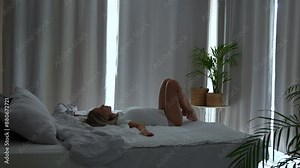 Woman lying down on bed and relax.