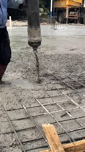 industrial concrete pump to distribute fresh wet concrete over a pre-installed steel