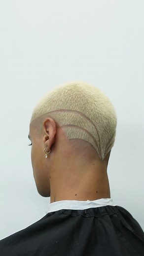 ZEUS on Instagram: "Buzz cut bleach with a little 🤌🏽✨ Whenever I do these types of creative buzz cuts I’m always making sure to stencil my designs so I get the best results. #dtlabarber #losangelesbarber #haircolor #bleached #buzzcut"