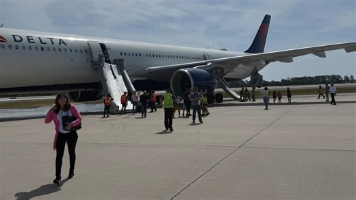 Passengers evacuated after Delta flight catches fire on runway at Orlando International Airport