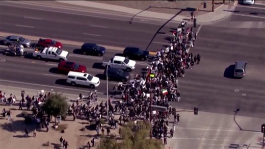 Teen girl accused of throwing water bottle at armed man supporting ICE