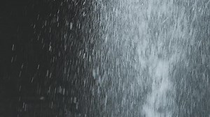 Download A close up of a waterfall with water pouring out for free