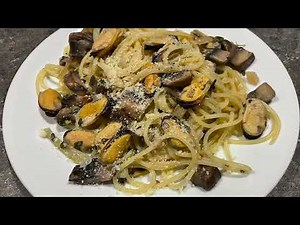 Basic Spaghetti and mussels in a garlic cream sauce.