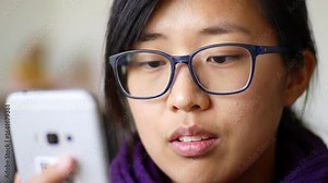 Person scanning a QR code to access information.