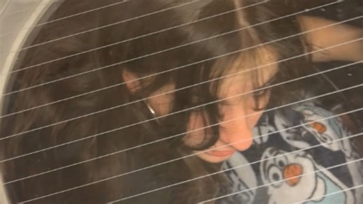 Mischief maker turns on a washing machine as a drunk girl climbs inside