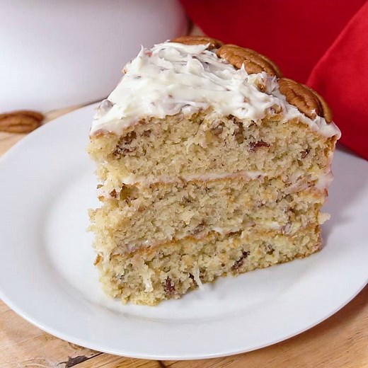 Italian Cream Cake has three layers of moist cake covered in cream cheese frosting with plenty of coconut and pecans. It’s not hard at all to make and is perfect for a holiday celebration. Printable Recipe: https://spicysouthernkitchen.com/italian-cream-cake/ | Spicy Southern Kitchen