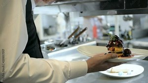 Waiter serving in motion on duty in restaurant