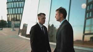 Two men in suits arguing - Free Stock Video