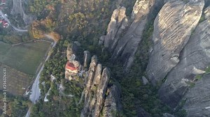 Flying over Meteora, Greece. Meteora is a rock formation, where major monastery system of Eastern Orthodox Christianity (second only to Mount Athos) is located. Aerial top down shot, 4K