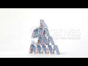 Stock Video - House of stacked playing cards falling down eventually footage