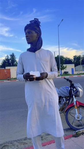 Exploring Traditional Attire Next to a Motorcycle