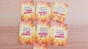 Outnumbered: Improbable Heroes Board Game - A Mensa Award Winning Superhero Math Game | Fun & Educational Game for Kids, Adults, and Families | STEM Toy to Learn Multiplication & Division