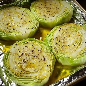 🥬🔥 Crispy Baked Cabbage Steaks are the underrated veggie side you NEED to try! Baked cabbage steaks preheat oven 400 wash and remove outer leaves trim stem off ,Recipe in First Coʍmеոτ 👇 Enjoy ❤️👇 | Grandma’s recipes