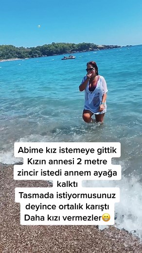 Beach Day Fun: Woman Enjoying Clear Blue Water