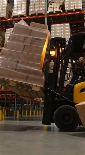Warehouse Chaos: Worker Drops Stack of Boxes!